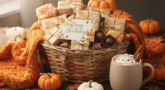 Cozy autumn birthday gift basket with warm blanket and seasonal decor