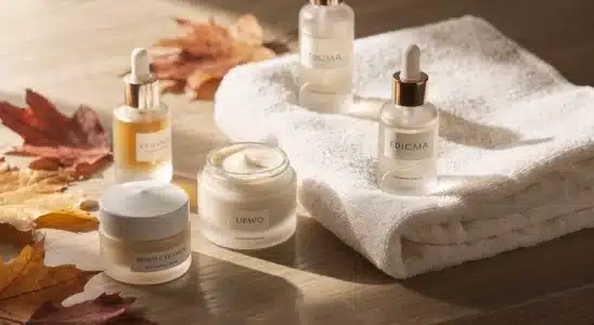 Rich moisturizing creams and hydrating skincare serums arranged for fall dry skin care.