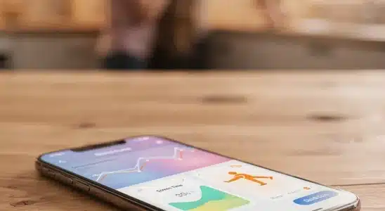 Smartphone displaying parental controls dashboard on a wooden desk