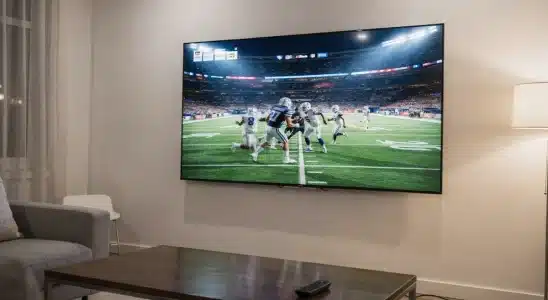 Smart TV streaming a live football game in a modern living room